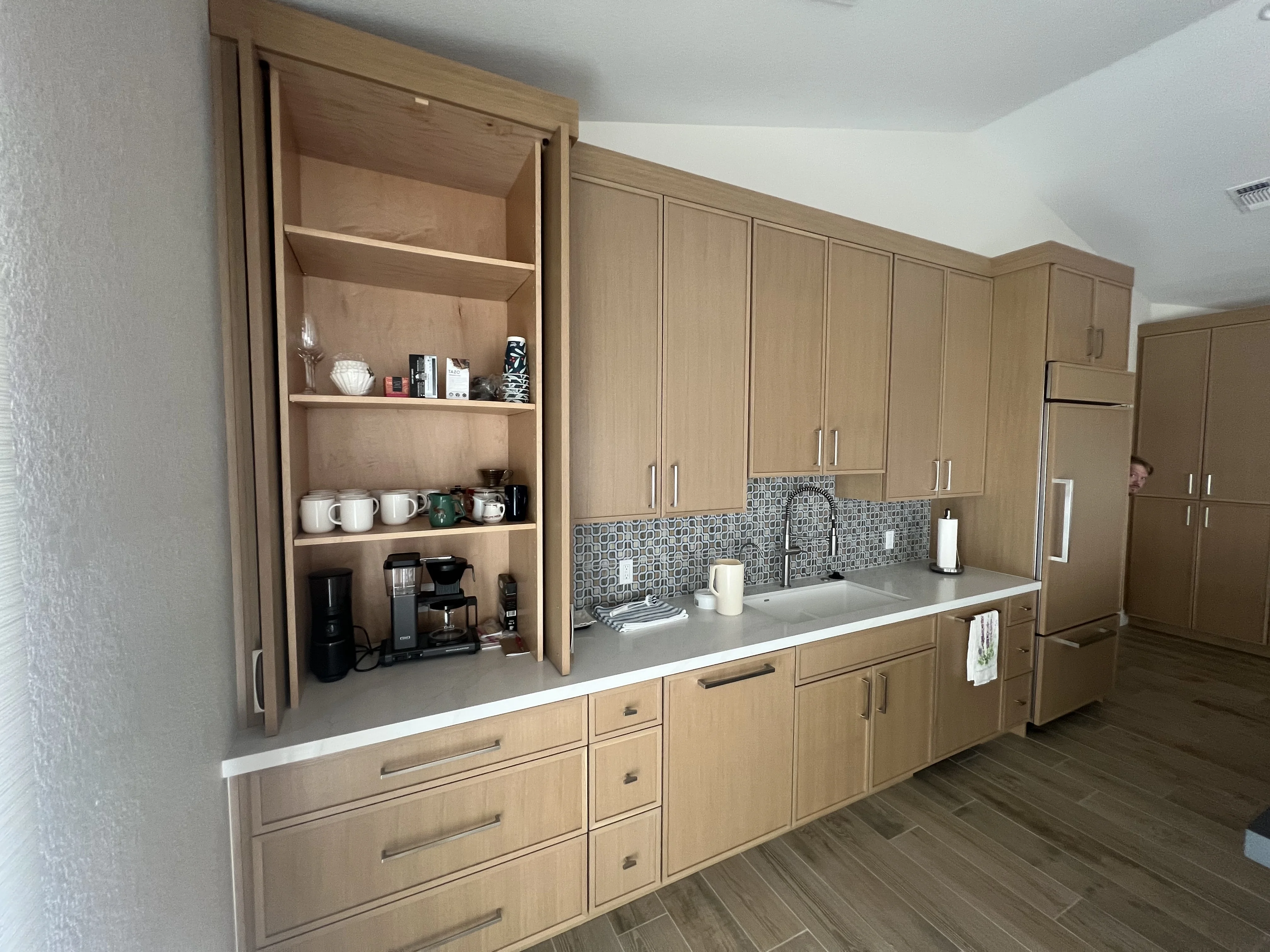 Rift white oak thin shaker kitchen pocket door in Rio Verde, AZ